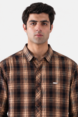 Tan and brown plaid men's shirt close-up